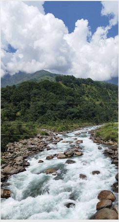 Mountain river under monsoon clouds